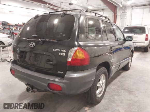 ✅ 2004 Hyundai Santa Fe GLS • VIN: KM8SC73E74U654567 • Lot: 43571152. Listed on IAAI with 167,999 mi. Free auction sales archive from the USA and detailed vehicle history report at DreamBid. Image 4.