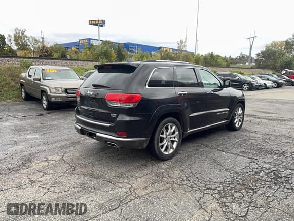 ✅ 2014 Jeep Grand Cherokee Summit • VIN: 1C4RJFJM8EC342679 • Lot: 90888345. Listed on Copart with 111,471 mi. Free auction sales archive from the USA and detailed vehicle history report at DreamBid. Image 4.
