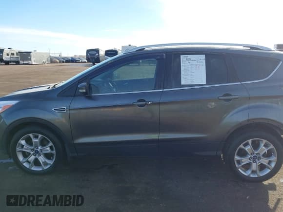 ✅ 2015 Ford Escape Titanium • VIN: 1FMCU9J93FUA72603 • Lot: 41631058. Listed on IAAI with 138,687 mi. Free auction sales archive from the USA and detailed vehicle history report at DreamBid. Image 14.
