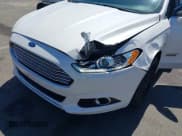 ✅ 2016 Ford Fusion Titanium • VIN: 3FA6P0SU2GR357508 • Lot: 42551834. Listed on IAAI with 177,425 mi. Free auction sales archive from the USA and detailed vehicle history report at DreamBid. Image 6.