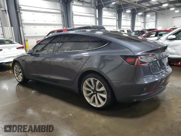 ✅ 2018 Tesla Model 3 Long Range Battery • VIN: 5YJ3E1EBXJF090615 • Лот: 92650005. Опубликован ранее на Copart с пробегом 65 939 миль. Бесплатный доступ к архиву аукционных продаж из США и подробный отчёт об истории автомобиля на DreamBid. Изображение 2.
