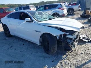 ✅ 2014 Jaguar XJ Supercharged • VIN: SAJWA1GT8EMV61318 • Lot: 43605281. Listed on IAAI with 64,000 mi. Free auction sales archive from the USA and detailed vehicle history report at DreamBid. Image 1.