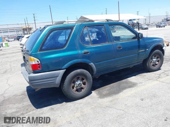 ✅ 1998 Isuzu Rodeo S • VIN: 4S2CK58W9W4313907 • Lot: 42843094. Listed on IAAI with 252,428 mi. Free auction sales archive from the USA and detailed vehicle history report at DreamBid. Image 4.