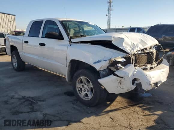 2006 Dodge Dakota SLT с VIN 1D7HE48N46S502721, выставлен на аукционе Copart как лот 77704414 с пробегом 195 514 миль миль и Списание • Salvage title. История ставок и продаж доступна на DreamBid. Изображение 4.