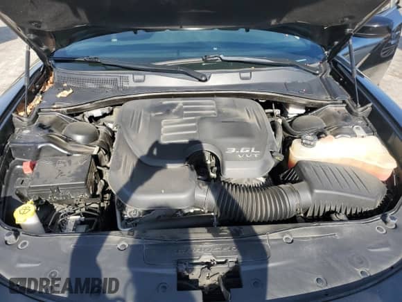 2020 Dodge Charger SXT z VIN 2C3CDXBG0LH189273, wystawiony jako Copart lot #87100465 z przebiegiem 65 267 mil mil oraz Szkoda całkowita • Salvage title. Historia ofert i sprzedaży dostępna na DreamBid. Obrazek 11.