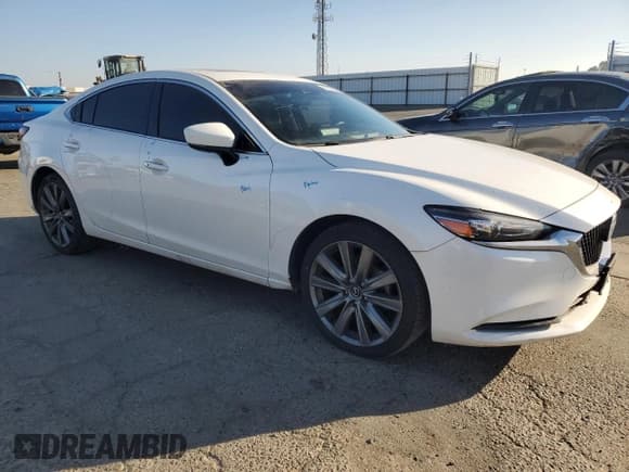 ✅ 2021 Mazda 6 Touring • VIN: JM1GL1VM0M1611282 • Лот: 85930235. Опубликован ранее на Copart с пробегом 124 447 миль. Бесплатный доступ к архиву аукционных продаж из США и подробный отчёт об истории автомобиля на DreamBid. Изображение 4.