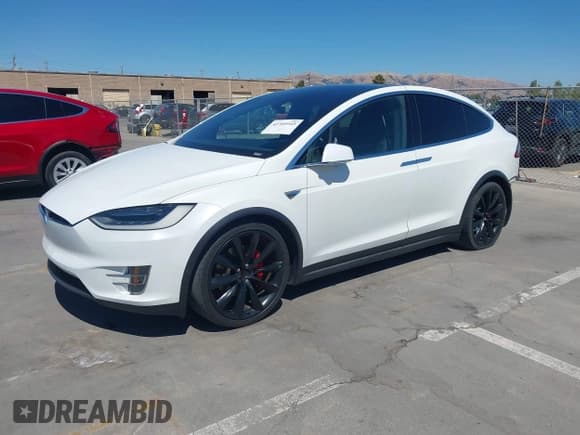 ✅ 2016 Tesla Model X P90D • VIN: 5YJXCBE40GF001366 • Lot: 42709945. Listed on IAAI with 47,355 mi. Free auction sales archive from the USA and detailed vehicle history report at DreamBid. Image 2.