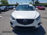 ✅ 2016 Mazda CX-5 Sport • VIN: JM3KE2BY5G0793032 • Lot: 42128706. Listed on IAAI with 52,010 mi. Free auction sales archive from the USA and detailed vehicle history report at DreamBid. Image 12.