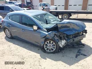 ✅ 2016 Mazda 3 i Touring • VIN: 3MZBM1L7XGM267257 • Lot: 42576066. Listed on IAAI with 46,617 mi. Free auction sales archive from the USA and detailed vehicle history report at DreamBid. Image 1.