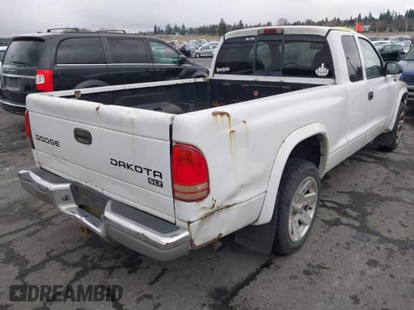2003 Dodge Dakota SLT with VIN 1D7HL42N83S296040, listed as a IAAI auction lot 41462371 with 250,407 mi miles and . Bid and sale history available at DreamBid. Image 6.