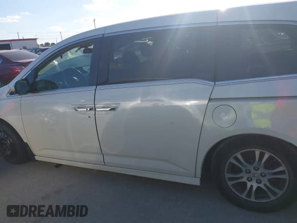 ✅ 2015 Honda Odyssey Touring Elite • VIN: 5FNRL5H96FB060244 • Lot: 43701520. Listed on IAAI with 185,250 mi. Free auction sales archive from the USA and detailed vehicle history report at DreamBid. Image 14.
