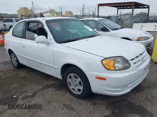 2005 Hyundai Accent GLS z VIN KMHCG35C45U327283, wystawiony jako IAAI lot #41585862 z przebiegiem 85 791 mil mil oraz . Historia ofert i sprzedaży dostępna na DreamBid. Obrazek 1.
