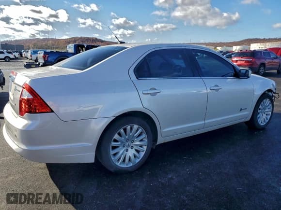 ✅ 2012 Ford Fusion Hybrid • VIN: 3FADP0L39CR237499 • Лот: 93891895. Опубликован ранее на Copart с пробегом 144 131 миль. Бесплатный доступ к архиву аукционных продаж из США и подробный отчёт об истории автомобиля на DreamBid. Изображение 3.