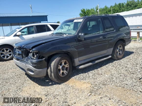✅ 2003 Ford Explorer Sport XLS • VIN: 1FMZU70E83UB65738 • Lot: 57590715. Listed on Copart with 176,678 mi. Free auction sales archive from the USA and detailed vehicle history report at DreamBid. Image 1.