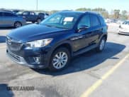 ✅ 2015 Mazda CX-5 Touring • VIN: JM3KE4CY1F0492976 • Lot: 43726497. Listed on IAAI with 201,660 mi. Free auction sales archive from the USA and detailed vehicle history report at DreamBid. Image 2.