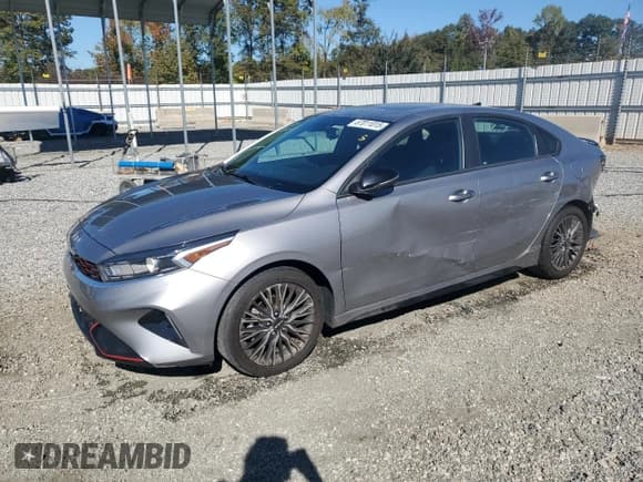 ✅ 2023 Kia Forte GT-Line • VIN: 3KPF54AD4PE671550 • Лот: 87011015. Опубликован ранее на Copart с пробегом 44 551 миль. Бесплатный доступ к архиву аукционных продаж из США и подробный отчёт об истории автомобиля на DreamBid. Изображение 1.