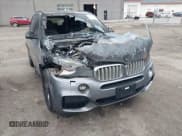 ✅ 2015 BMW X5 xDrive50i • VIN: 5UXKR6C50F0J76918 • Lot: 43696994. Listed on IAAI with 141,000 mi. Free auction sales archive from the USA and detailed vehicle history report at DreamBid. Image 6.