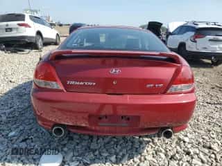 2006 Hyundai Tiburon GT с VIN KMHHN65FX6U190598, выставлен на аукционе Copart как лот 61143675 с пробегом Не указан миль и Списание • Salvage title. История ставок и продаж доступна на DreamBid. Изображение 6.