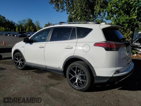 ✅ 2018 Toyota RAV4 Hybrid SE • VIN: JTMJJREV8JD167632 • Lot: 81094075. Listed on Copart with 105,449 mi. Free auction sales archive from the USA and detailed vehicle history report at DreamBid. Image 2.