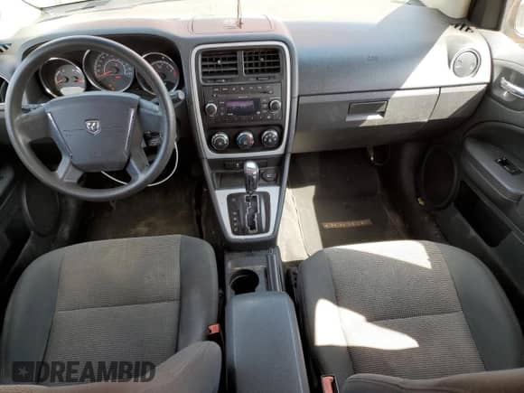 2011 Dodge Caliber Mainstreet z VIN 1B3CB3HAXBD108046, wystawiony jako Copart lot #67521764 z przebiegiem 152 280 mil mil oraz Szkoda całkowita • Salvage title. Historia ofert i sprzedaży dostępna na DreamBid. Obrazek 8.