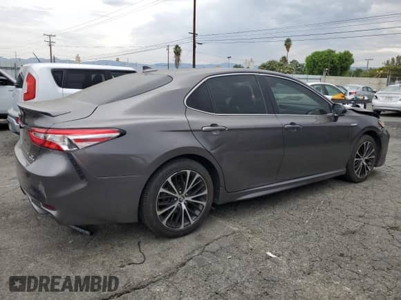 2020 Toyota Camry Hybrid SE с VIN 4T1G31AK2LU519524, выставлен на аукционе Copart как лот 70734245 с пробегом 85 086 миль миль и Списание • Salvage title. История ставок и продаж доступна на DreamBid. Изображение 3.