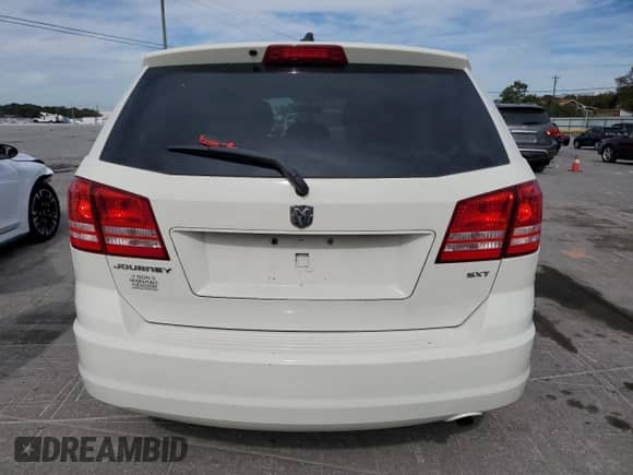 2013 Dodge Journey American Value with VIN 3C4PDCAB0DT575812, listed as a Copart auction lot 86771425 with 113,450 mi miles and Salvage title. Bid and sale history available at DreamBid. Image 6.