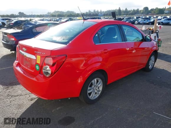✅ 2014 Chevrolet Sonic LT • VIN: 1G1JC5SH1E4191254 • Lot: 43253273. Listed on IAAI with 104,251 mi. Free auction sales archive from the USA and detailed vehicle history report at DreamBid. Image 4.