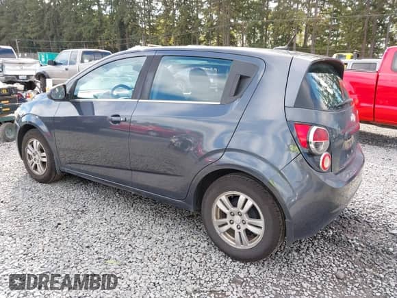 2013 Chevrolet Sonic LT with VIN 1G1JC6SG2D4148084, listed as a IAAI auction lot 43459236 with 94,963 mi miles and . Bid and sale history available at DreamBid. Image 3.