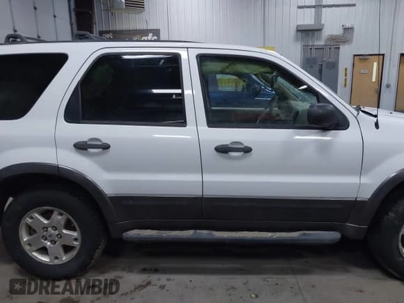 ✅ 2006 Ford Escape XLT • VIN: 1FMCU93156KC93719 • Lot: 41995488. Listed on IAAI with 218,213 mi. Free auction sales archive from the USA and detailed vehicle history report at DreamBid. Image 14.