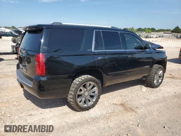 2015 Chevrolet Tahoe LTZ with VIN 1GNSKCKC6FR170659, listed as a Copart auction lot 69412835 with 252,198 mi miles and Salvage title. Bid and sale history available at DreamBid. Image 3.