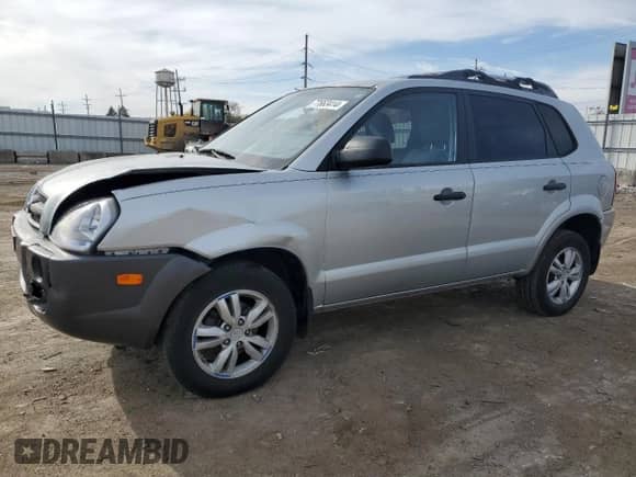 2009 Hyundai Tucson GLS with VIN KM8JM12B79U012399, listed as a Copart auction lot 77663414 with 164,615 mi miles and Salvage title. Bid and sale history available at DreamBid. Image 1.
