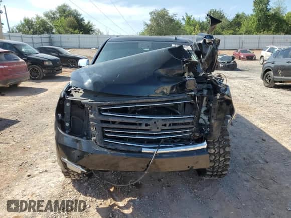 2015 Chevrolet Tahoe LTZ with VIN 1GNSKCKC6FR170659, listed as a Copart auction lot 69412835 with 252,198 mi miles and Salvage title. Bid and sale history available at DreamBid. Image 5.