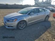 ✅ 2016 Ford Fusion Titanium Hybrid • VIN: 3FA6P0RU0GR127178 • Лот: 94665415. Опубликован ранее на Copart с пробегом 141 144 миль. Бесплатный доступ к архиву аукционных продаж из США и подробный отчёт об истории автомобиля на DreamBid. Изображение 1.