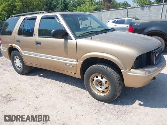 ✅ 1999 GMC Jimmy SLT • VIN: 1GKDT13W7X2545842 • Lot: 42973812. Wystawiony na IAAI z przebiegiem 236 268 mil. Bezpłatny archiwum sprzedaży aukcyjnych z USA i szczegółowy raport historii pojazdu na DreamBid. Zdjęcie 1.