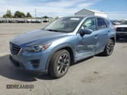 ✅ 2016 Mazda CX-5 Grand Touring • VIN: JM3KE4DY9G0612426 • Lot: 82179145. Wystawiony na Copart z przebiegiem 147 130 mil. Bezpłatny archiwum sprzedaży aukcyjnych z USA i szczegółowy raport historii pojazdu na DreamBid. Zdjęcie 1.