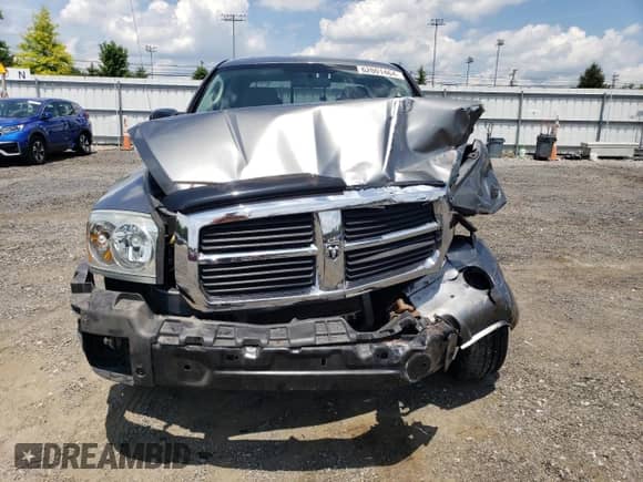 2007 Dodge Dakota SLT z VIN 1D7HW48KX7S256455, wystawiony jako Copart lot #62001464 z przebiegiem 109 239 mil mil oraz Szkoda całkowita • Salvage title. Historia ofert i sprzedaży dostępna na DreamBid. Obrazek 5.