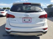 ✅ 2018 Hyundai Santa Fe 2.4L • VIN: 5NMZT3LBXJH078932 • Lot: 89566205. Listed on Copart with 104,864 mi. Free auction sales archive from the USA and detailed vehicle history report at DreamBid. Image 6.