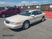✅ 1997 Lincoln Continental • VIN: 1LNLM97V4VY622662 • Lot: 40301011. Listed on IAAI with 129,028 mi. Free auction sales archive from the USA and detailed vehicle history report at DreamBid. Image 2.