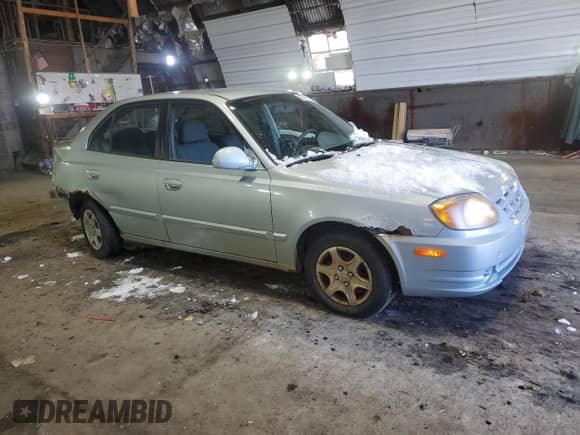 2005 Hyundai Accent GLS z VIN KMHCG45C15U602419, wystawiony jako Copart lot #47759675 z przebiegiem 58 133 mil mil oraz Szkoda całkowita • Salvage title. Historia ofert i sprzedaży dostępna na DreamBid. Obrazek 4.