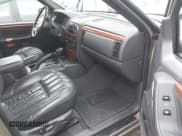 ✅ 1999 Jeep Grand Cherokee Limited • VIN: 1J4GW68N4XC705158 • Лот: 43712573. Опубликован ранее на IAAI с пробегом 251 619 миль. Бесплатный доступ к архиву аукционных продаж из США и подробный отчёт об истории автомобиля на DreamBid. Изображение 5.