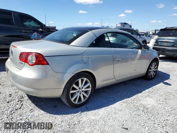 ✅ 2009 Volkswagen Eos Komfort • VIN: WVWBA71F59V015935 • Lot: 87113725. Listed on Copart with 151,325 mi. Free auction sales archive from the USA and detailed vehicle history report at DreamBid. Image 3.