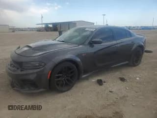 ✅ 2022 Dodge Charger Scat Pack Widebody • VIN: 2C3CDXGJ0NH101085 • Лот: 49080895. Опубликован ранее на Copart с пробегом 25 728 миль. Бесплатный доступ к архиву аукционных продаж из США и подробный отчёт об истории автомобиля на DreamBid. Изображение 1.