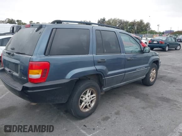 ✅ 2004 Jeep Grand Cherokee Laredo • VIN: 1J4GW48S74C223970 • Lot: 42408360. Listed on IAAI with 238,099 mi. Free auction sales archive from the USA and detailed vehicle history report at DreamBid. Image 4.