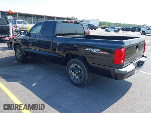 2006 Dodge Dakota SLT with VIN 1D7HE42NX6S666354, listed as a IAAI auction lot 42394779 with 124,633 mi miles and . Bid and sale history available at DreamBid. Image 3.