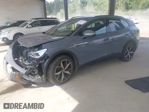 ✅ 2023 Volkswagen ID.4 Pro S • VIN: 1V2FMPE82PC011398 • Lot: 42583220. Listed on IAAI with 27,117 mi. Free auction sales archive from the USA and detailed vehicle history report at DreamBid. Image 2.