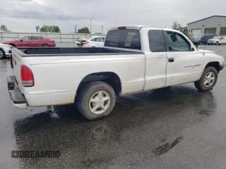 ✅ 1998 Dodge Dakota SLT • VIN: 1B7GL22X6WS693570 • Lot: 52000825. Wystawiony na Copart z przebiegiem 125 985 mil. Bezpłatny archiwum sprzedaży aukcyjnych z USA i szczegółowy raport historii pojazdu na DreamBid. Zdjęcie 3.