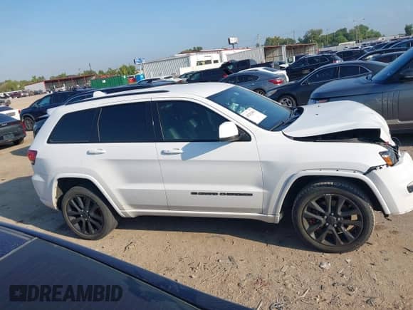 2022 Jeep Grand Cherokee Laredo E with VIN 1C4RJEAGXNC127857, listed as a IAAI auction lot 43202403 with 66,201 mi miles and . Bid and sale history available at DreamBid. Image 13.