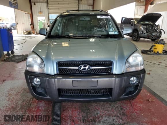 2006 Hyundai Tucson GLS with VIN KM8JN72D26U346076, listed as a Copart auction lot 77447474 with 123,993 mi miles and Salvage title. Bid and sale history available at DreamBid. Image 5.