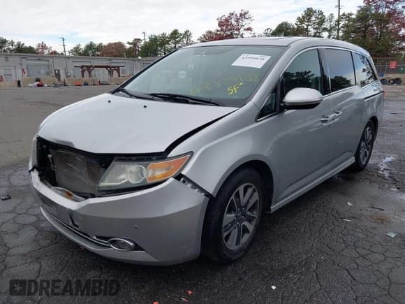 ✅ 2014 Honda Odyssey Touring • VIN: 5FNRL5H90EB105838 • Lot: 43594038. Listed on IAAI with 97,956 mi. Free auction sales archive from the USA and detailed vehicle history report at DreamBid. Image 2.