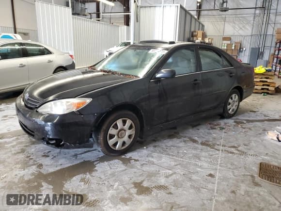 ✅ 2003 Toyota Camry SE • VIN: JTDBE32K830240816 • Lot: 90244385. Listed on Copart with 319,607 mi. Free auction sales archive from the USA and detailed vehicle history report at DreamBid. Image 1.